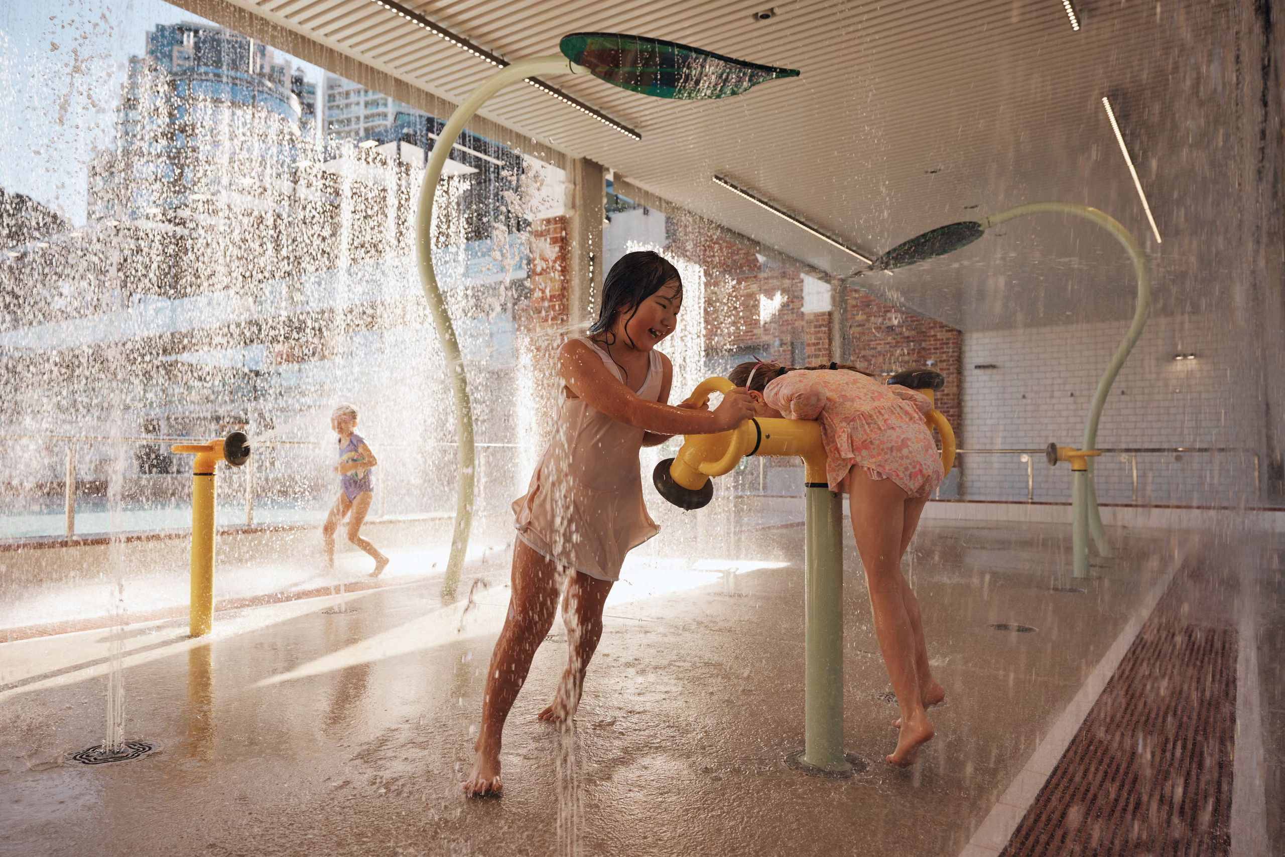 Children in the kids' pool and splash pad