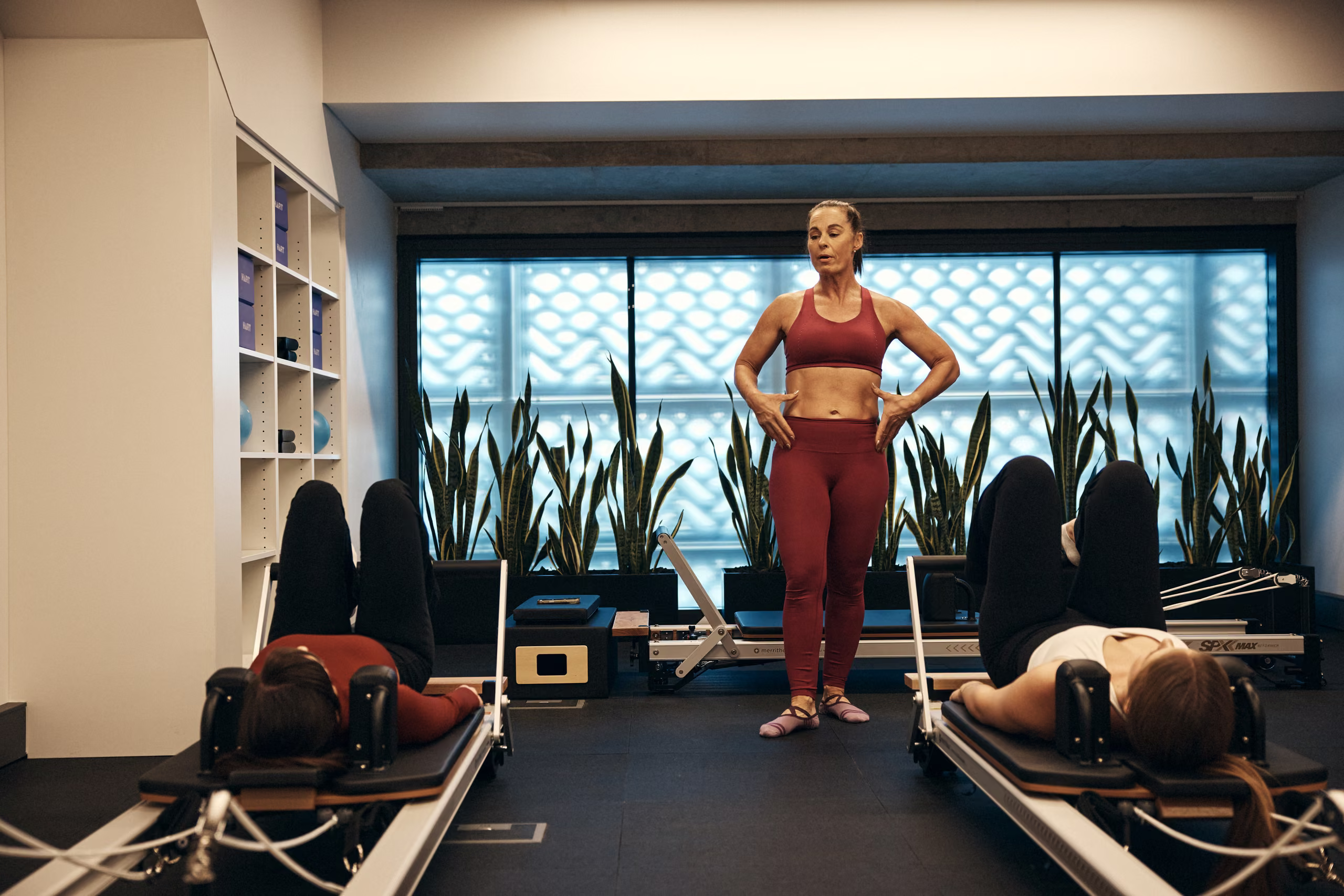 Reformer Pilates studio with instructor